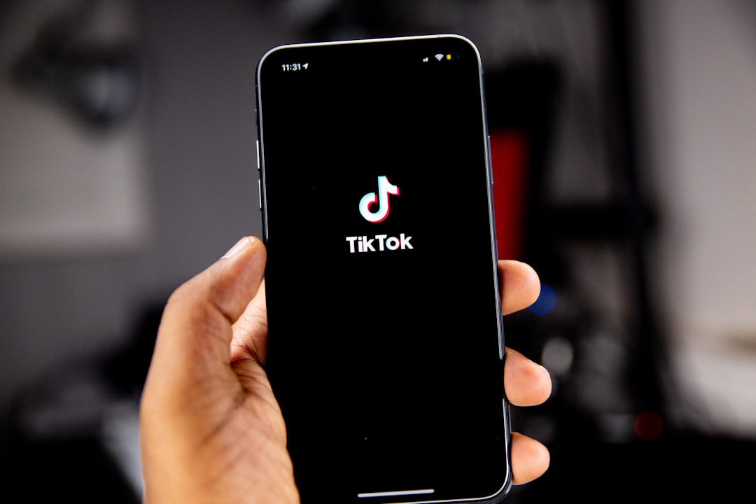 Person holding a smartphone with TikTok open for an advertising campaign